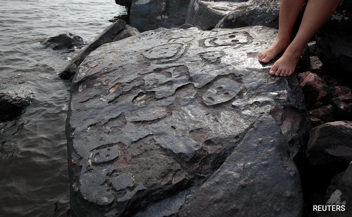 Amazon River Drought Reveals 2,000-Year-Old Human Faces Sculpted In Stone