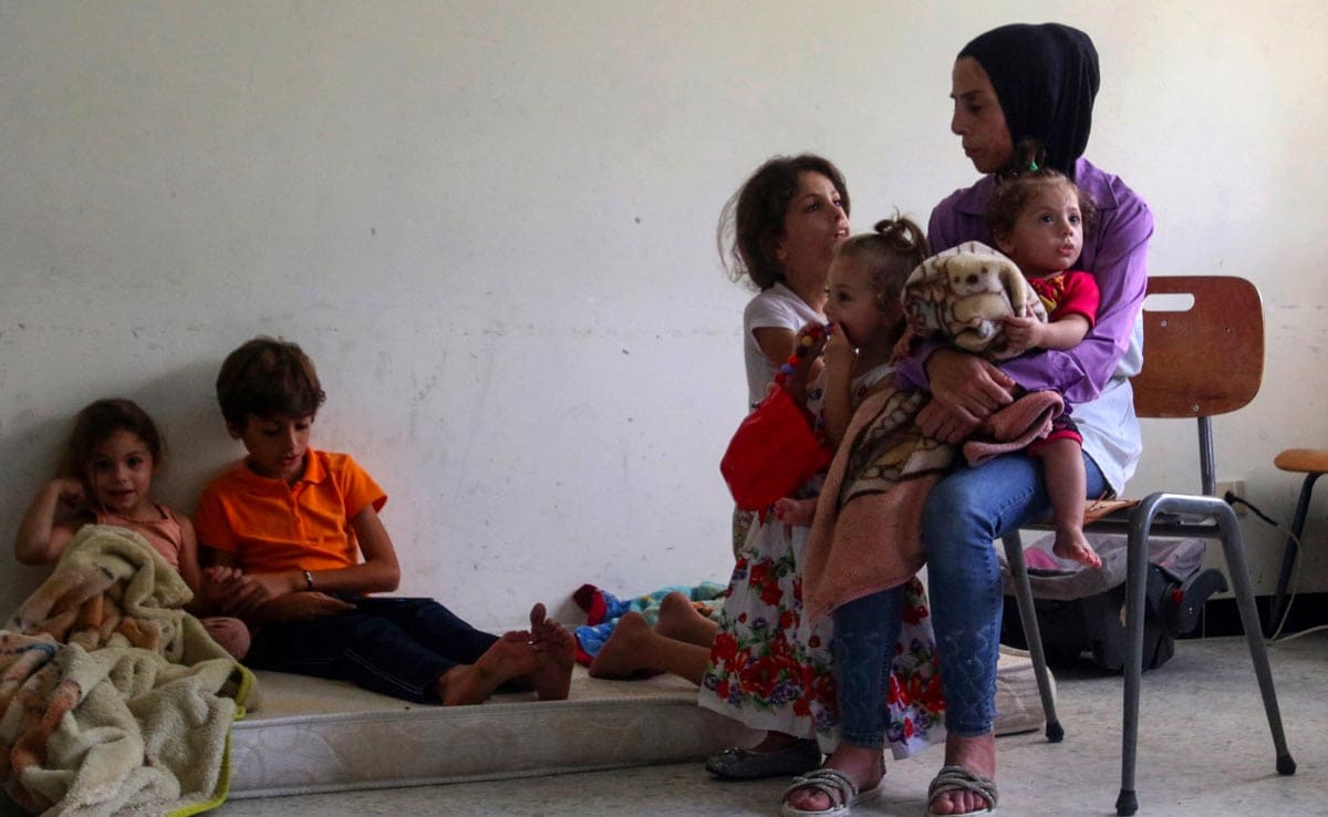 Lebanon Families Flee After Israel Strikes, Take Refuge In Schools