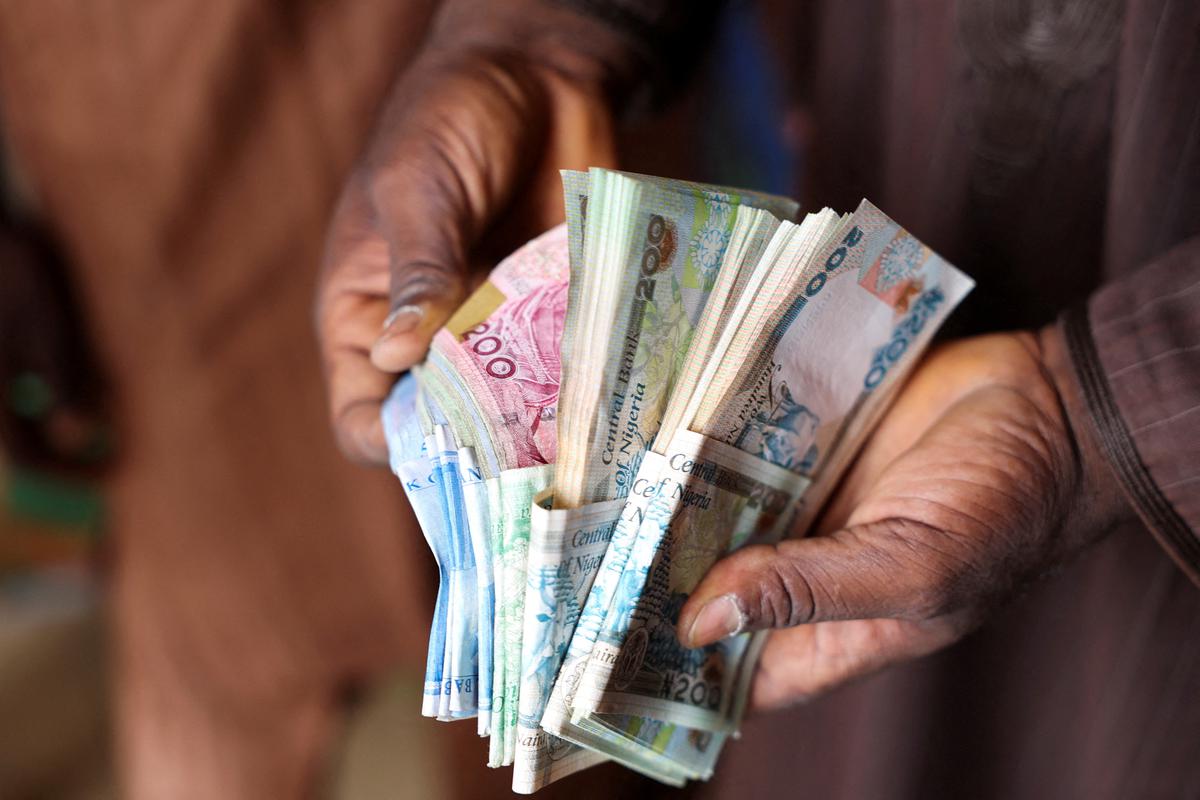 How Nigeria’s naira fell to record low amid conflict and instability