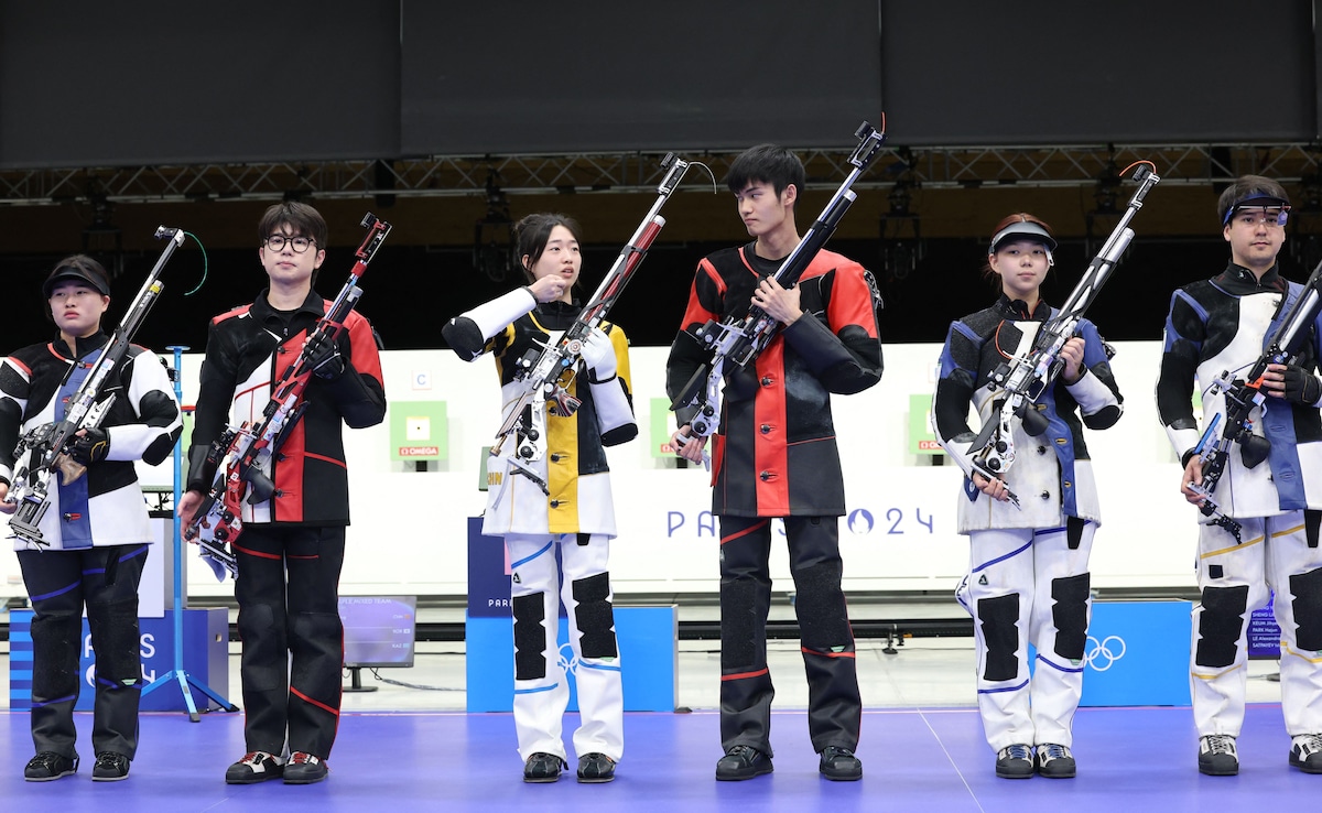 China Takes First Olympic Gold As Rain Disrupts Games