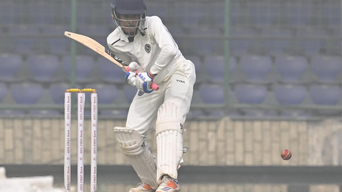 Sharandeep grinds out a half-century on a slow-moving opening day