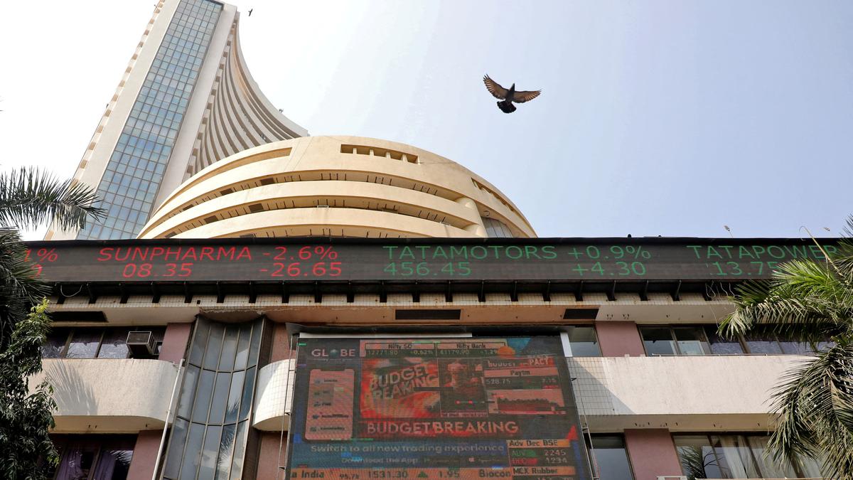 Sensex, Nifty settle almost flat in highly volatile trade; metal, power stocks drag