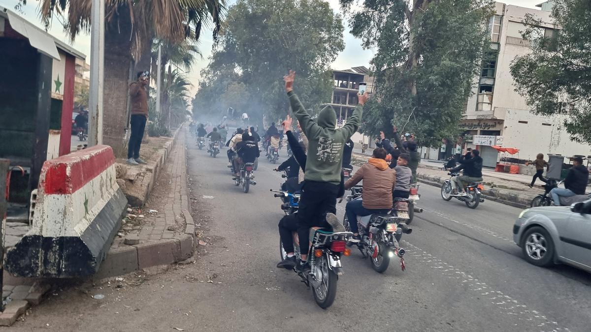 syria rebels celebrate in captured homs