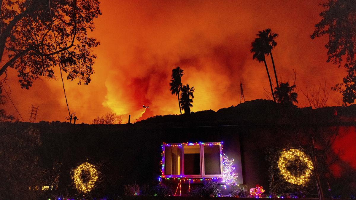 Los Angeles investigates fire blame as curfew enforced