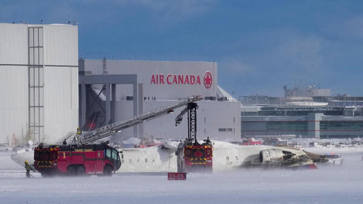 Delta plane flips on landing at Toronto airport, injuring 8