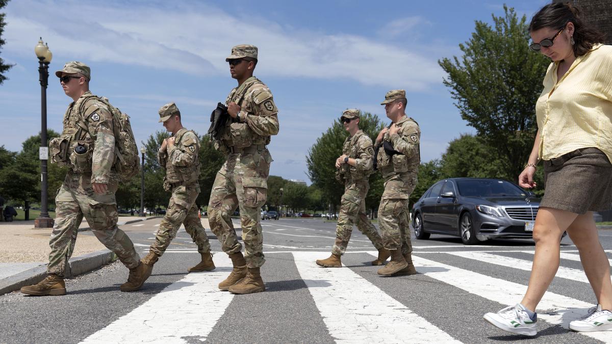 Pentagon says some National Guard units in Washington now carrying firearms as Trump targets more cities