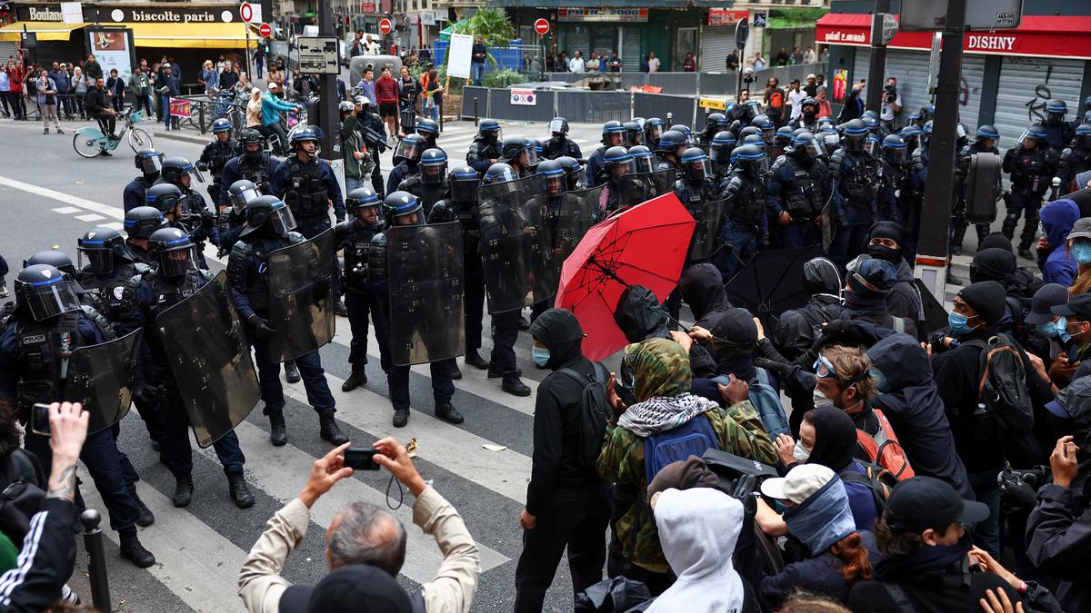 French protesters clash with police; roads blocked, fires set, 200 arrested