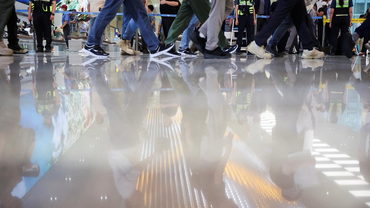 South Korean workers detained in U.S. head home as Seoul seeks support for new visa