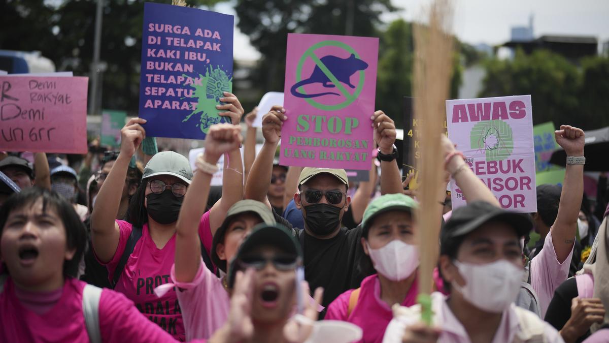 With brooms in hand as symbol for change, Indonesian women join Jakarta protests