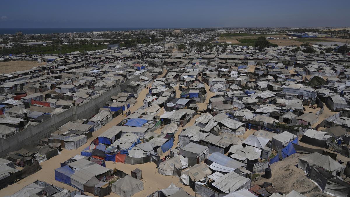 Strikes across Gaza kill at least 31 as international scholars accuse Israel of genocide