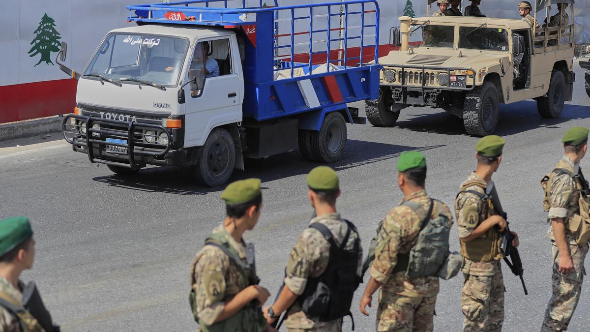 Palestinian factions hand over truckloads of weapons in Lebanon’s largest refugee camp