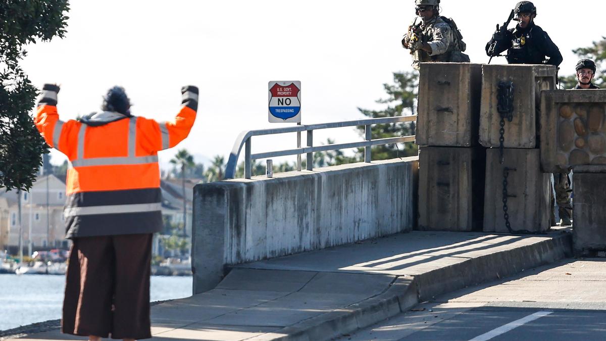 Trump administration sues California over law banning masked federal agents