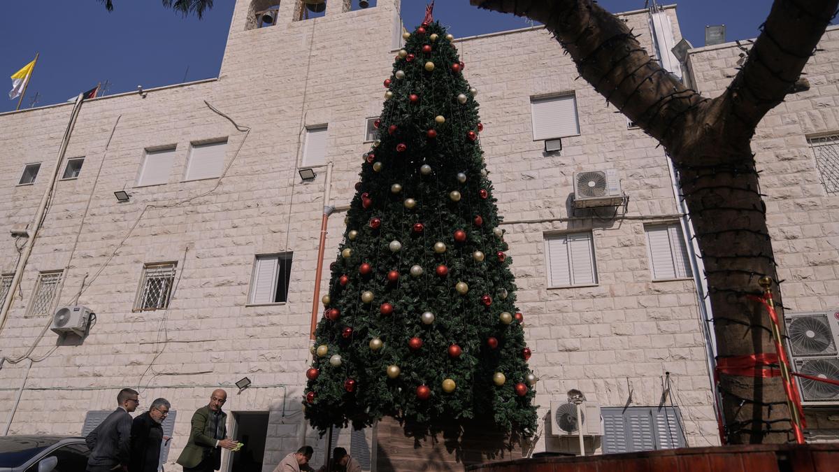 Three Palestinians arrested on suspicion of torching Christmas tree at Catholic church in West Bank