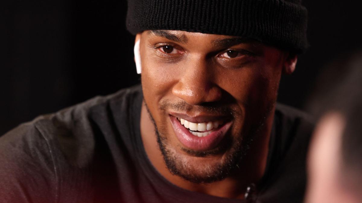 Anthony Joshua returns to Britain after car crash that killed two friends in Nigeria