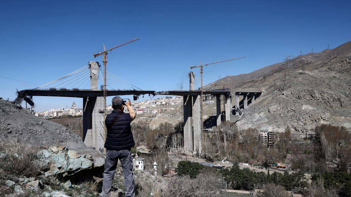 Iran turns bombed Karaj Bridge into a symbol of resistance