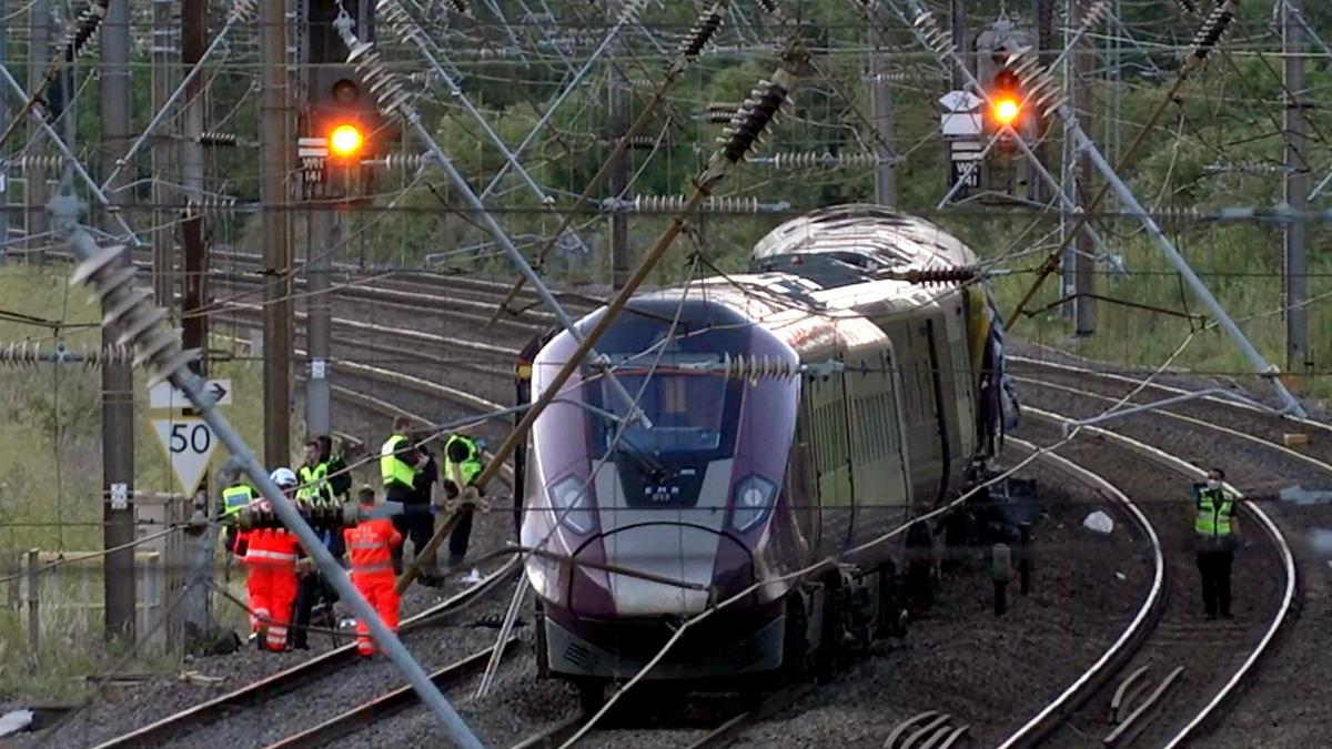Two trains collide north of London, killing at least one person