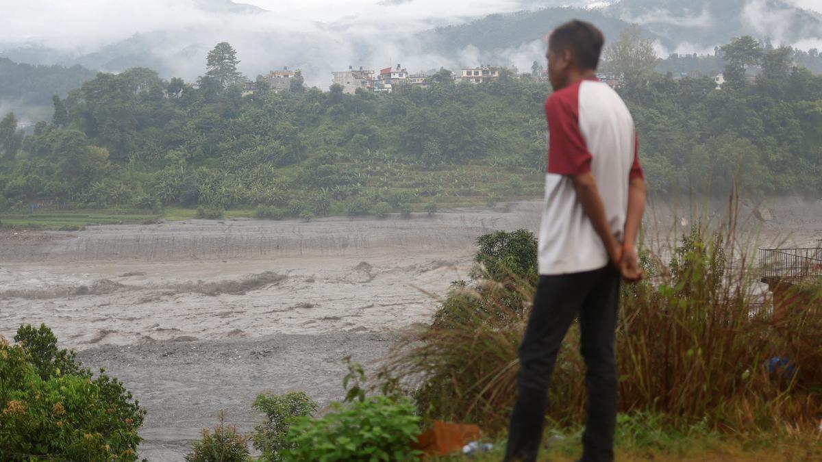 Nepal flood survivors return to ruins to salvage memories
