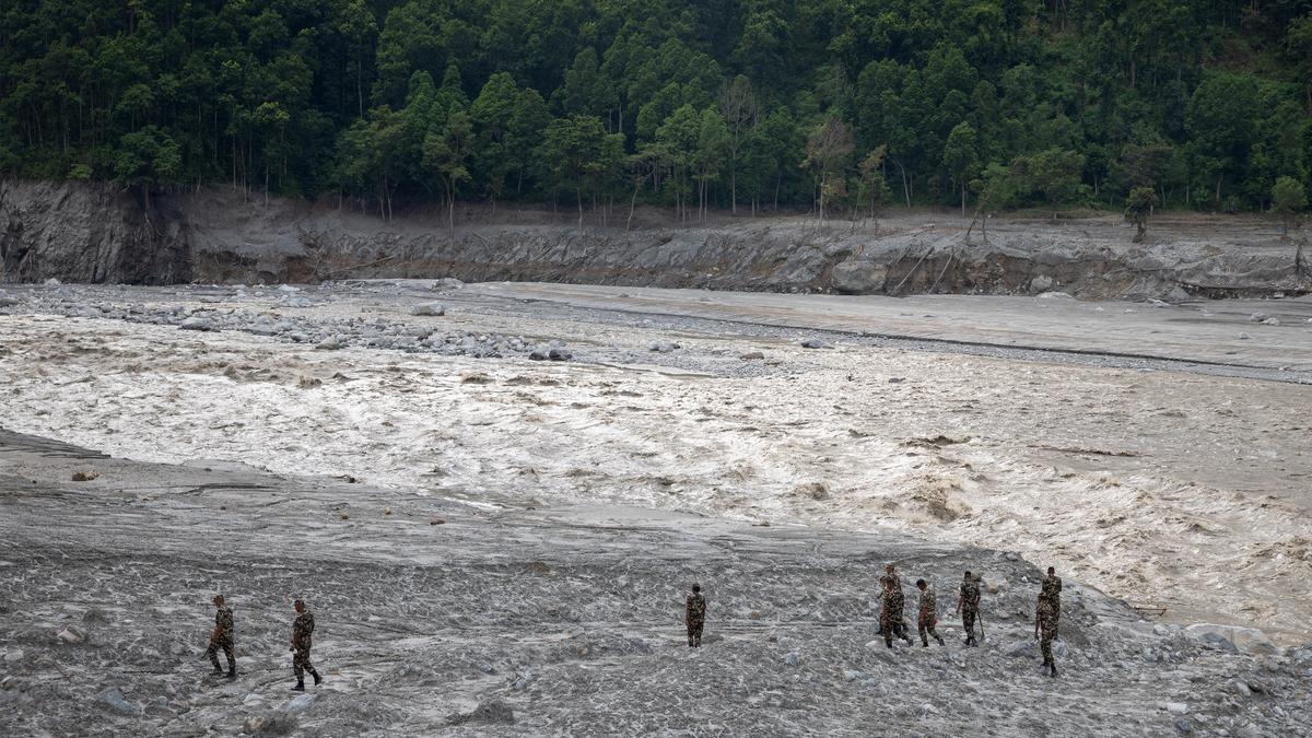 Nepal flood survivors join rescue and relief operations as they grieve, search for their loved ones