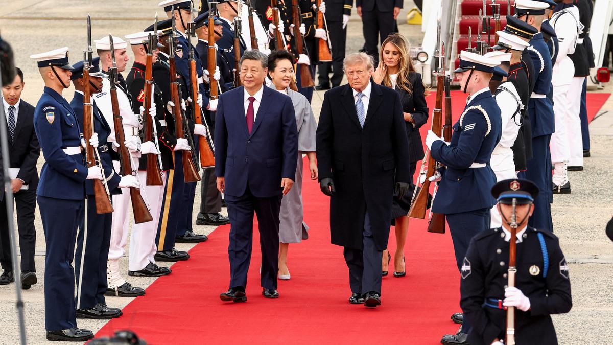Xi arrives in Washington, kicking off his state visit with rare planeside welcome from Trump