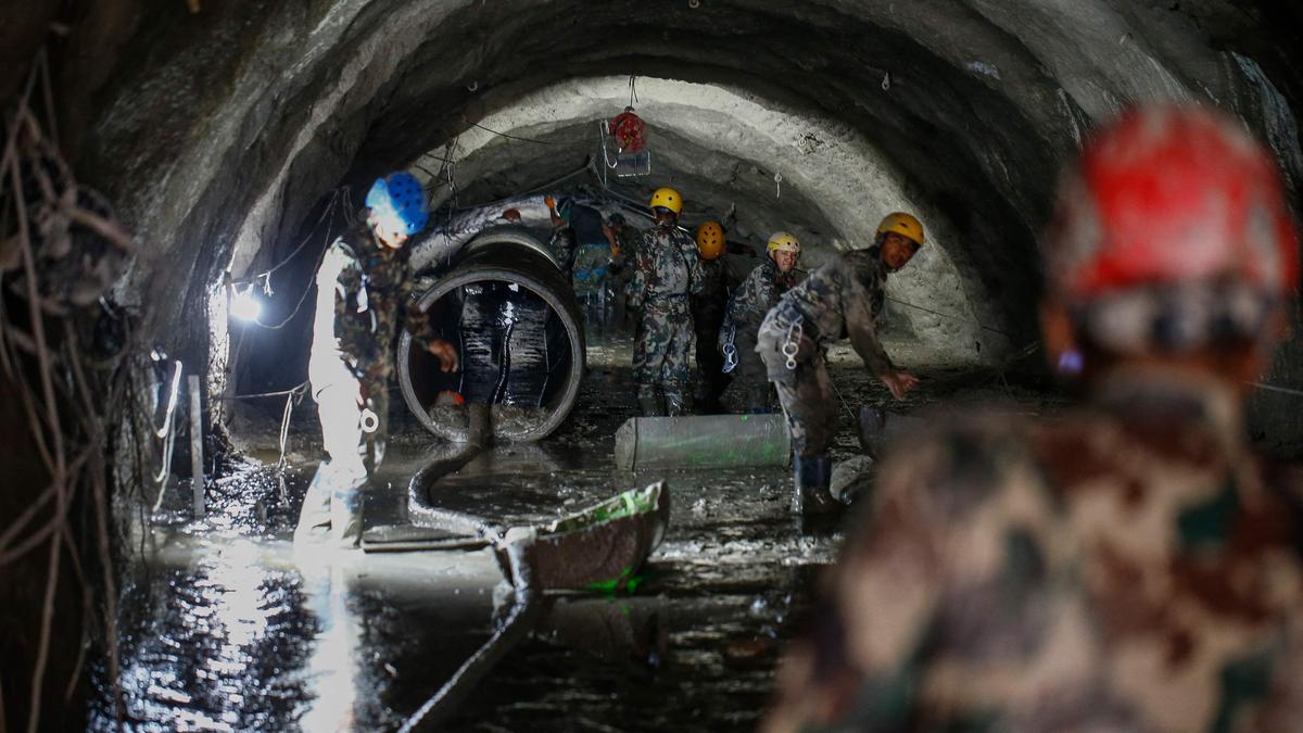 Nepal flash floods: Rescue teams clear 70 metres of debris in tunnel as they close in on six trapped workers