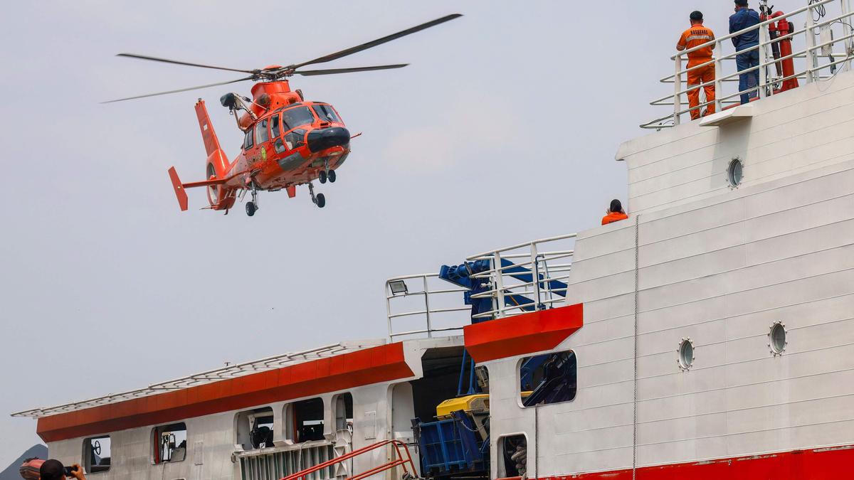 Indonesia begins operation to right capsized ship in Java Sea as 129 remain missing