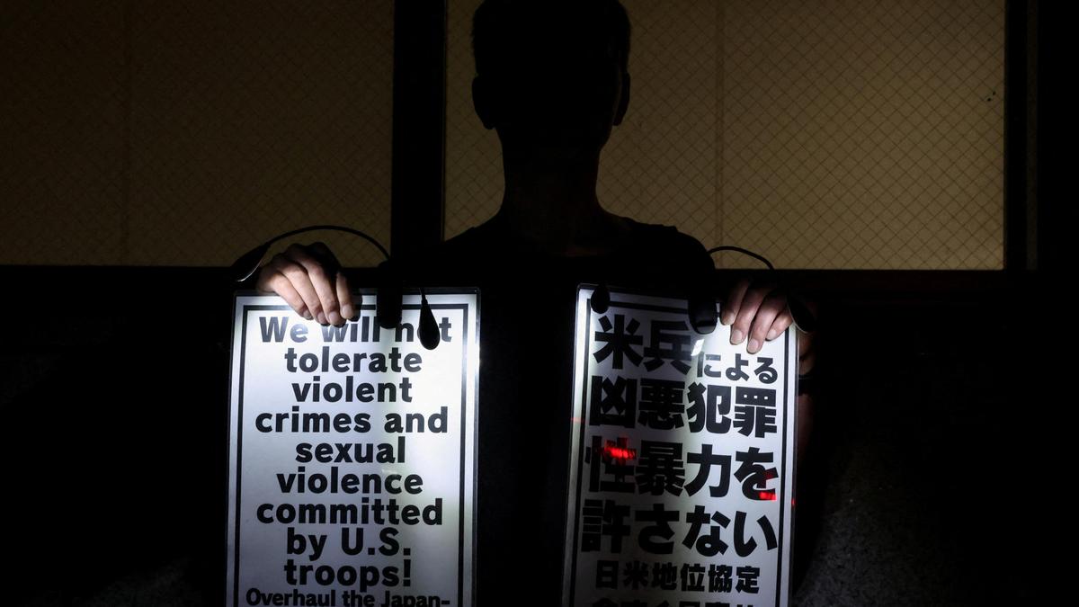 U.S. military restricts troops from leaving the base in Okinawa after Marine is arrested in a killing