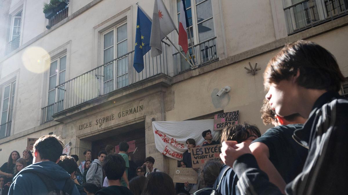Teenager loses hand picking up grenade in France school protests