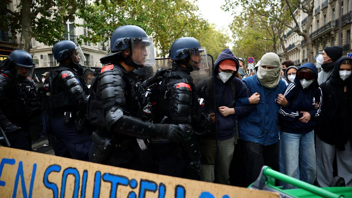 France suspends use of stun grenades to police student protests