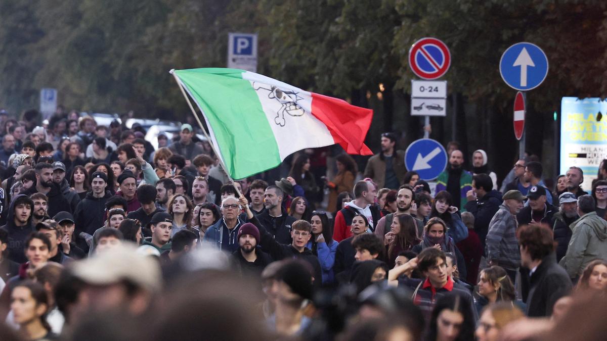 Soldiers guard centre of Milan as thousands of protesters march in cities across Europe